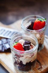 Cashew and dates vegan tiramisu with chocolate in portion jars. Healthy dessert
