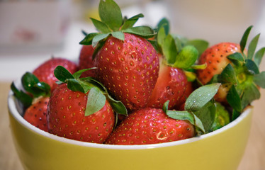 Ripe red strawberries on wooden table