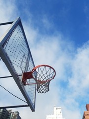 basketball hoop on background of blue sky