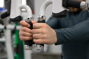 Man in the gym with kettlebells and weights.