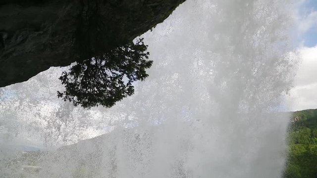 Steinsdalsfossen - one of the gorgeous waterfalls in Norway. Steindalsfossen waterfall in a rainy day. Steinsdalsfossen waterfalls in Norway. It is possible to walk under this waterfall.
