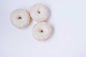 Donuts on the white bacground. Copy space. Top view. 