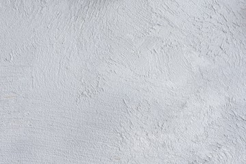 Gray textured cement background with cracked rough structure and empty space for image or text. Grey grungy blank space with abstract scratches on surface 