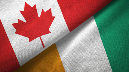 Fototapeta na wymiar Canada and Cote d'Ivoire Ivory coast two flags textile fabric texture