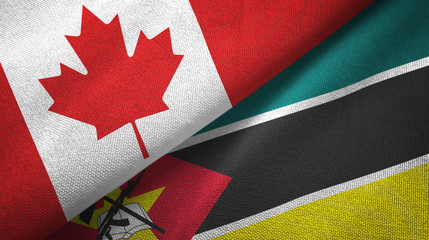 Fototapeta na wymiar Canada and Mozambique two flags textile cloth, fabric texture