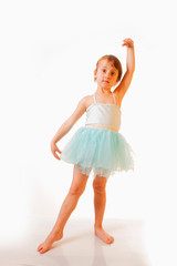 Naklejka premium Cute little child girl dancing and playing in the ballet.