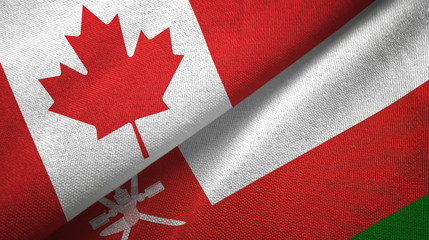 Fototapeta na wymiar Canada and Oman two flags textile cloth, fabric texture