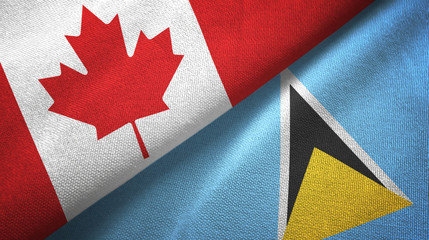 Fototapeta na wymiar Canada and Saint Lucia two flags textile cloth, fabric texture