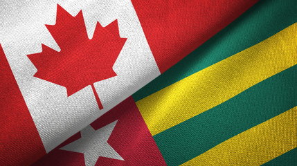 Fototapeta na wymiar Canada and Togo two flags textile cloth, fabric texture