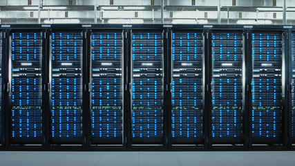 Camera Slide-Trough Shot of a Working Data Center With Rows of Rack Servers. Led Lights Blinking...