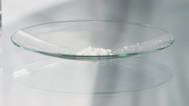 White Powder being pipetted by a Scinetist in sterile lab