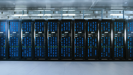 Shot of a Working Data Center With Rows of Rack Servers. Led Lights Blinking and Computers are Working.