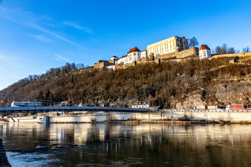 Fototapeta na wymiar panoramic view to Veste Oberhaus at the hill with river Danube in Passau