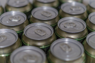 Beer cans in a row. Close up.
