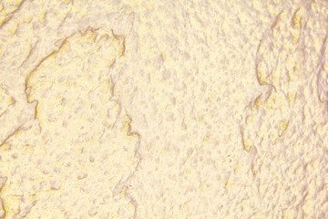 abstract golden grunge background. The texture of the wall of decorative plaster.