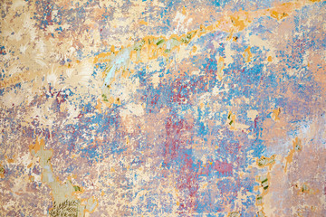 old wall with removed wallpaper and rest of paint