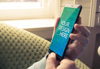 User Holding Smartphone Mockup