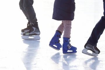 Fototapeta na wymiar people skating on the ice rink