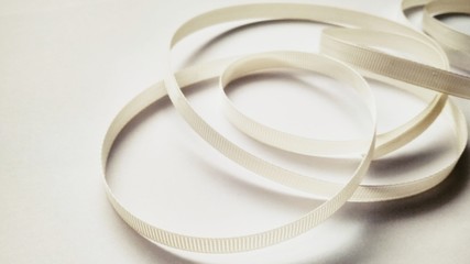 White ribbon close up on white background