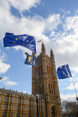 Fototapeta premium E.U. Flag flying in front of Union ack flag at Houses of Parliament London