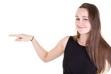 Happy beautiful young woman pointing away