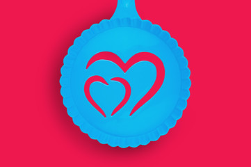 One blue plastic stencil with handle for drawing picture of double heart on cappuccino or other...