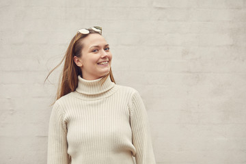 portrait of young happy woman outside with sunglass