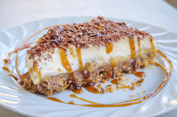 Delicious slice of a banoffee pie with caramel syrup