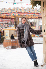 Happy woman in fur mink coat