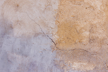 Old plastered painted in two colors wall texture background