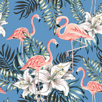 Pink flamingo, palm leaves, white lily flowers, blue background. Vector floral seamless pattern. Tropical illustration. Exotic plants and birds. Summer beach design. Paradise nature © ojardin