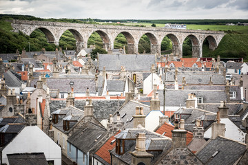 Old croft houses in Cullen, fishing village on Moray Firth, Scotland. Cullen Viaduct in the...