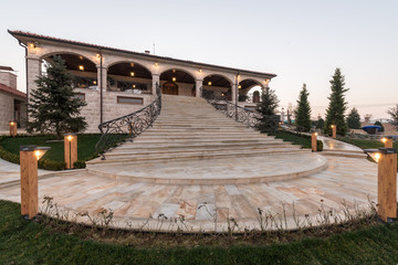 Entrance with big marble stairs of mansion by dusk - obrazy, fototapety, plakaty