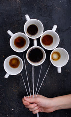 Balloons from coffee cups and delicious marshmallow with lavender flavor on a black background.
