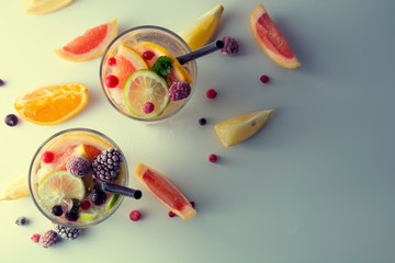 Fresh citrus infused flavored lemonade. Refreshing summer homemade cocktail with lemon, lime, orange and grapefruit.