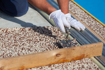 Laying the floor around the outdoor pool.