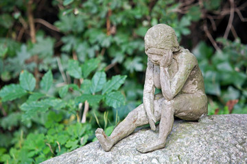 statue of sadness and sorrow at municipal cemetery in Amsterdam, The Netherlands