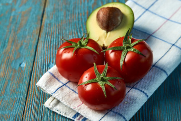 Breakfast food with fresh avocado and tomatoes, close-up.