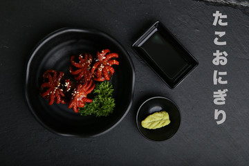 Squid sushi with sesame oil.Empty with Wasabi and Chiso sauce