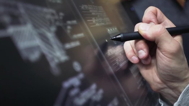 Architect Using creative pen display Tablet Working with drawings in office