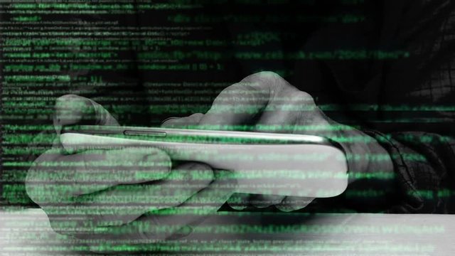 Hacker using smartphone, cyber criminal