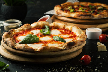Delicious pizza with mozzarella on a wooden board