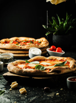 Delicious pizza with mozzarella on a wooden board