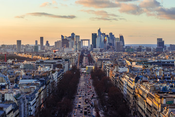 Naklejka na ściany i meble Magnificent look from Arc de Triomphe (Triumphal Arc) towards the la défense - the parisien trade quarter, before sunset, with beatiful clouds