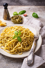 Italian spaghetti pasta with pesto sauce