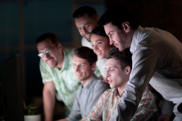 business colleagues looking at the computer screen