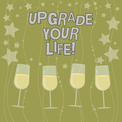 Text sign showing Upgrade Your Life. Conceptual photo improve your way of living Getting wealthier and happier Filled Cocktail Wine Glasses with Scattered Stars as Confetti Stemware