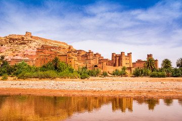Fototapeta premium Amazing view of Kasbah Ait Ben Haddou near Ouarzazate in the Atlas Mountains of Morocco. UNESCO World Heritage Site since 1987. Artistic picture. Beauty world.
