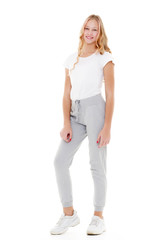 Fototapeta premium Little school girl pointing to her empty white t-shirt.