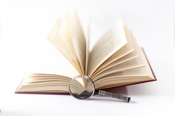 Book and magnifying glass isolated on white. Search concept.